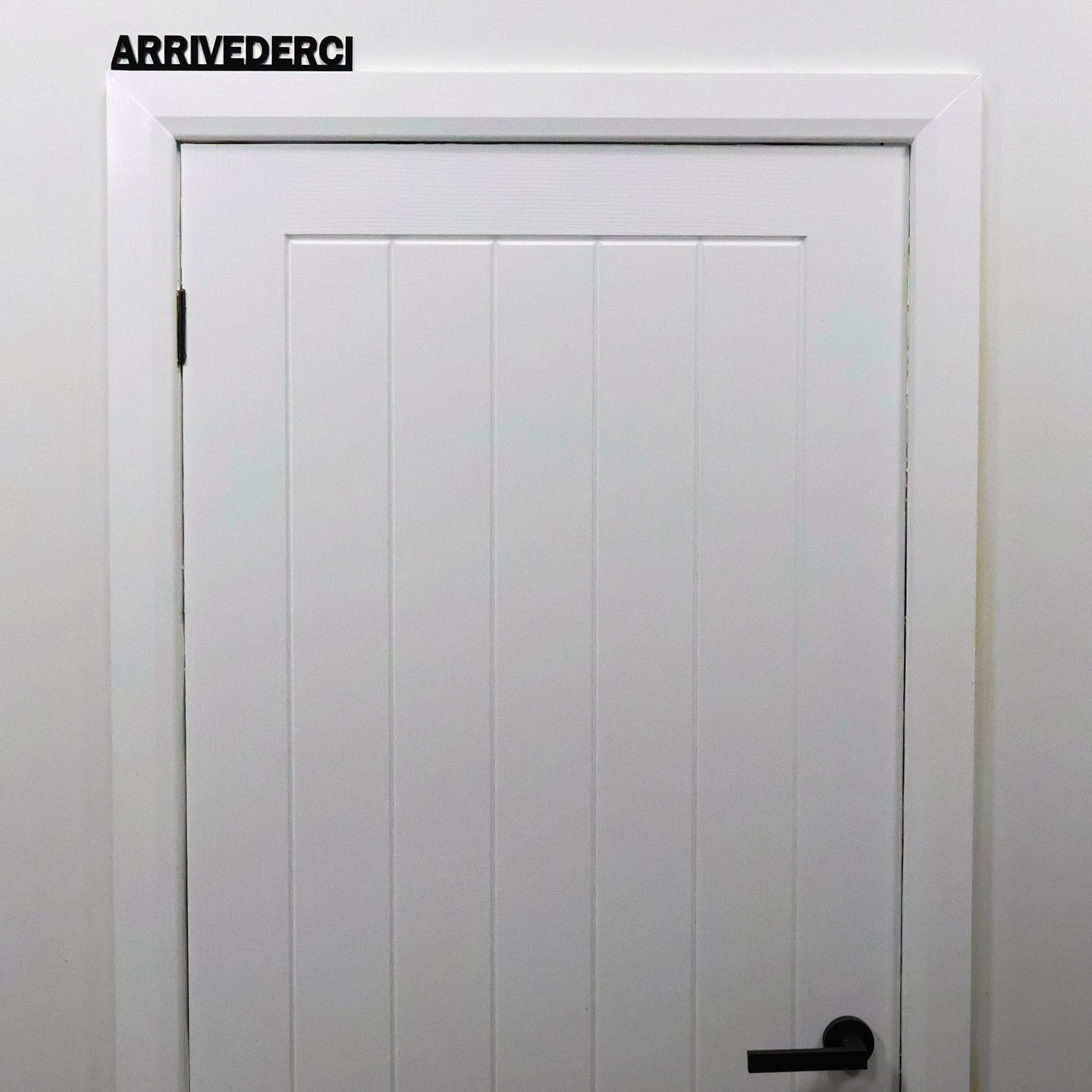 Hallway interior styling with ARRIVEDERCI Door Topper displayed