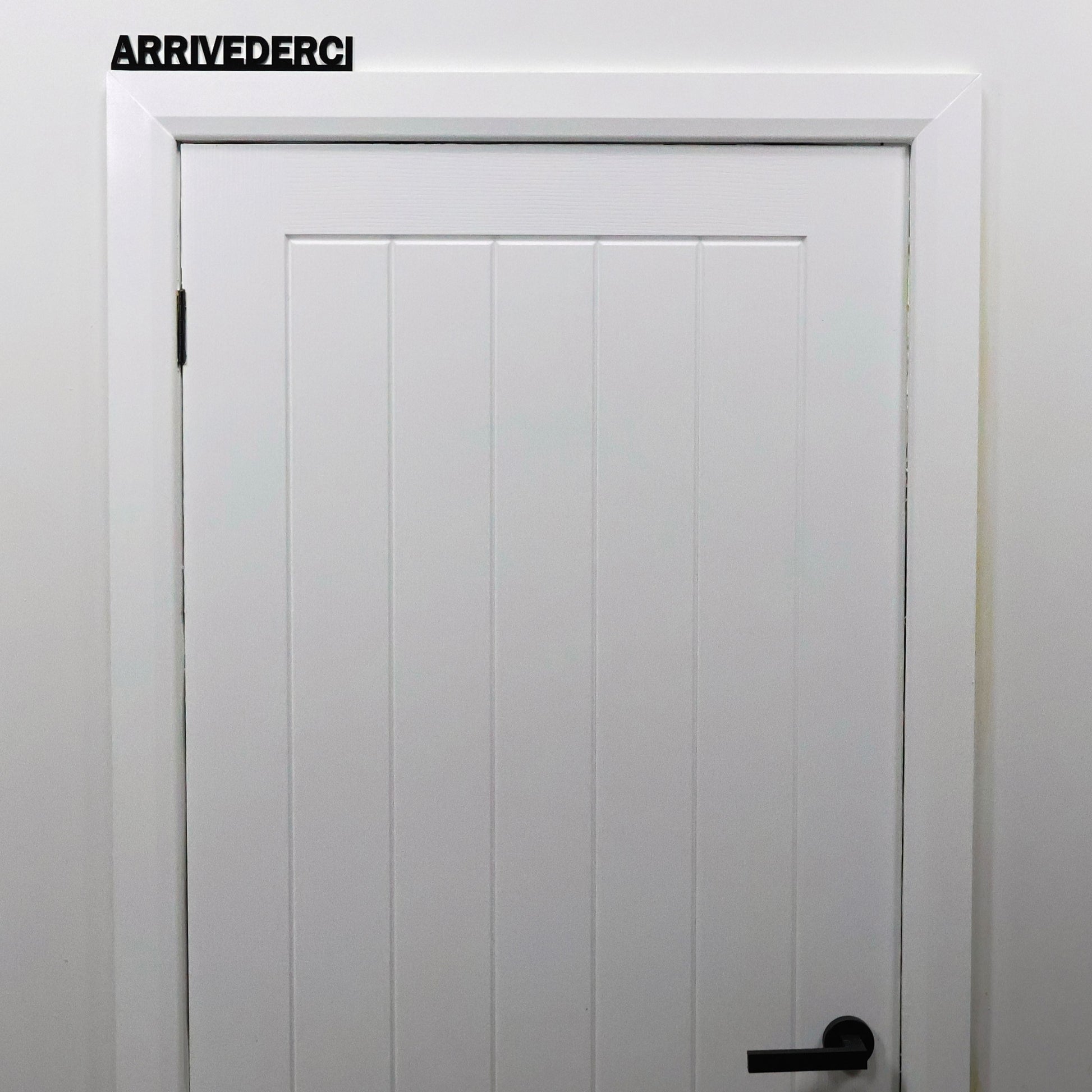 Hallway interior styling with ARRIVEDERCI Door Topper displayed