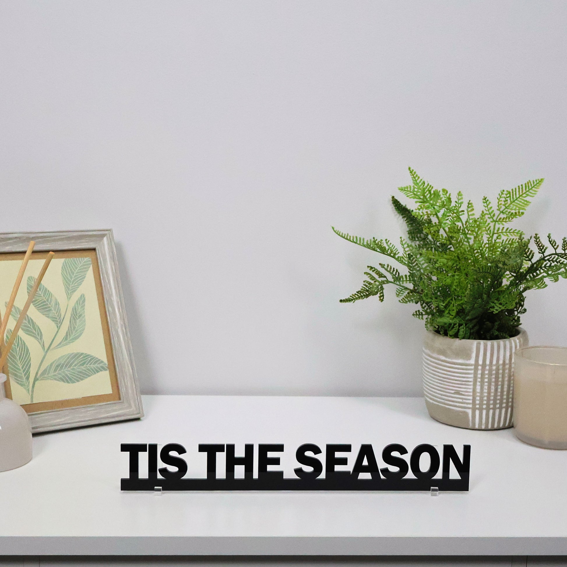 TIS THE SEASON sign shown freestanding on a mantel with Christmas decor