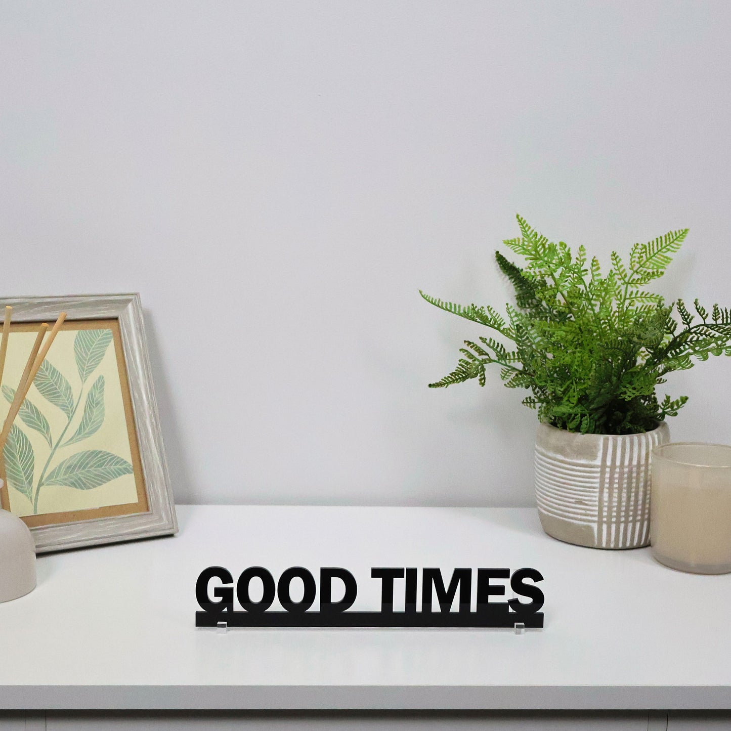 GOOD TIMES Door Topper displayed freestanding on a shelf with bar accessories