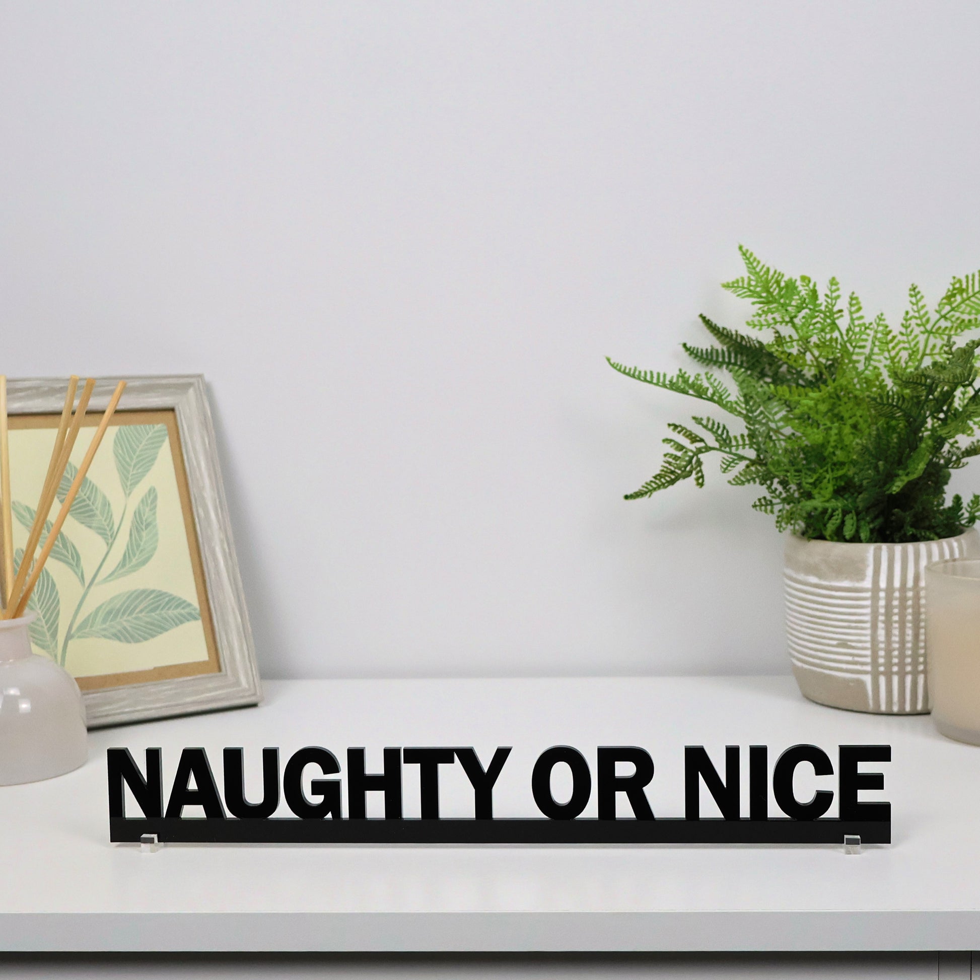 Gift-ready NAUGHTY OR NICE Door Topper packaged for Christmas, perfect Secret Santa or novelty gift.