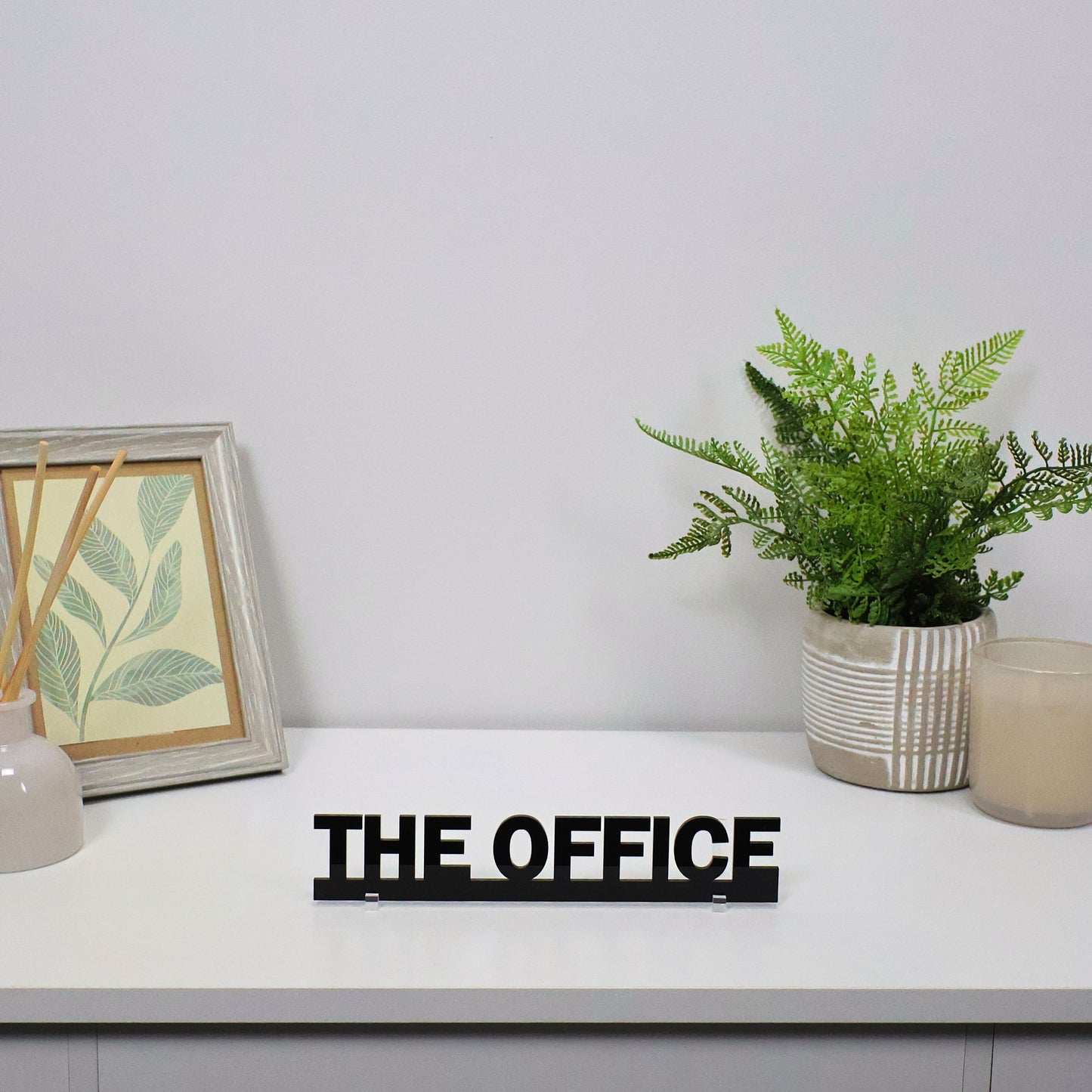 THE OFFICE Door Topper displayed above workspace doorway with minimal decor