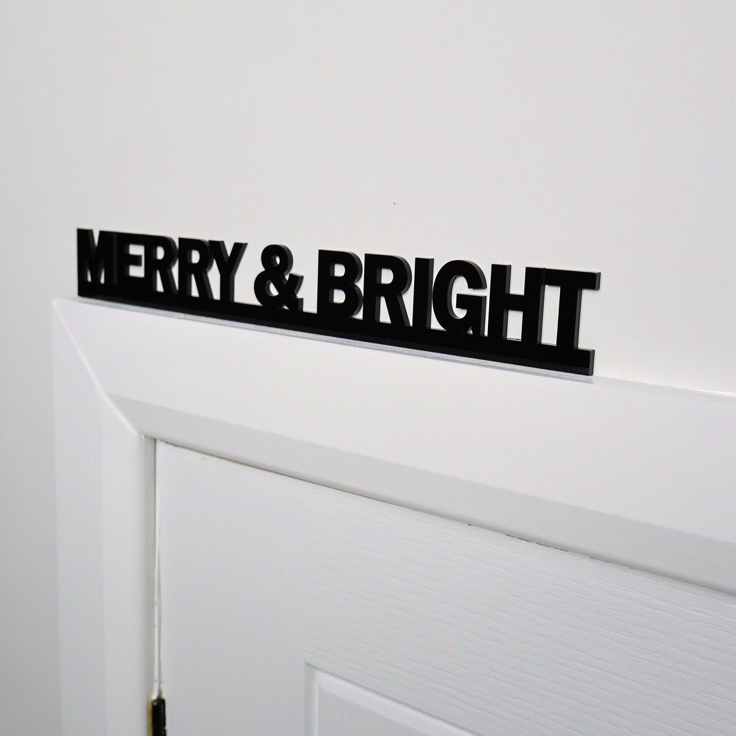 Side view showing sleek black acrylic sign thickness and finish