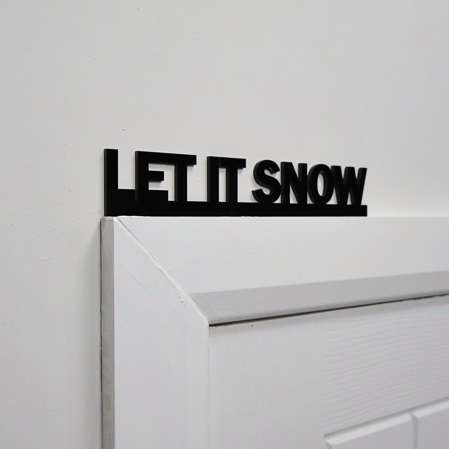 Handmade black acrylic Christmas wall sign made in the UK