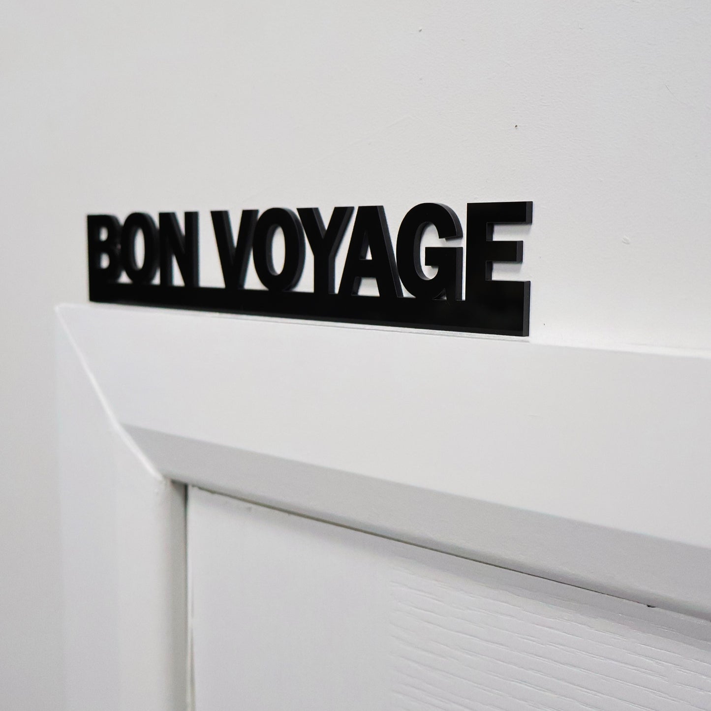 Farewell wall sign above a door frame – sleek and stylish home decor detail