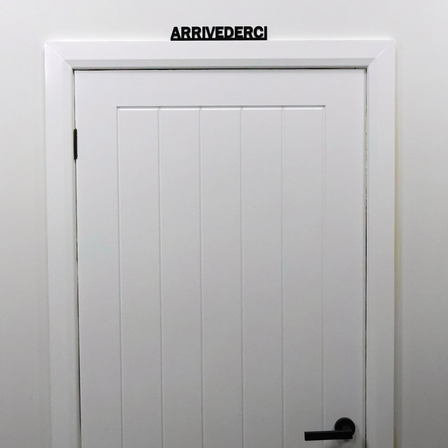 Modern Italian quote wall decor – stylish black acrylic farewell sign for hallways or offices.