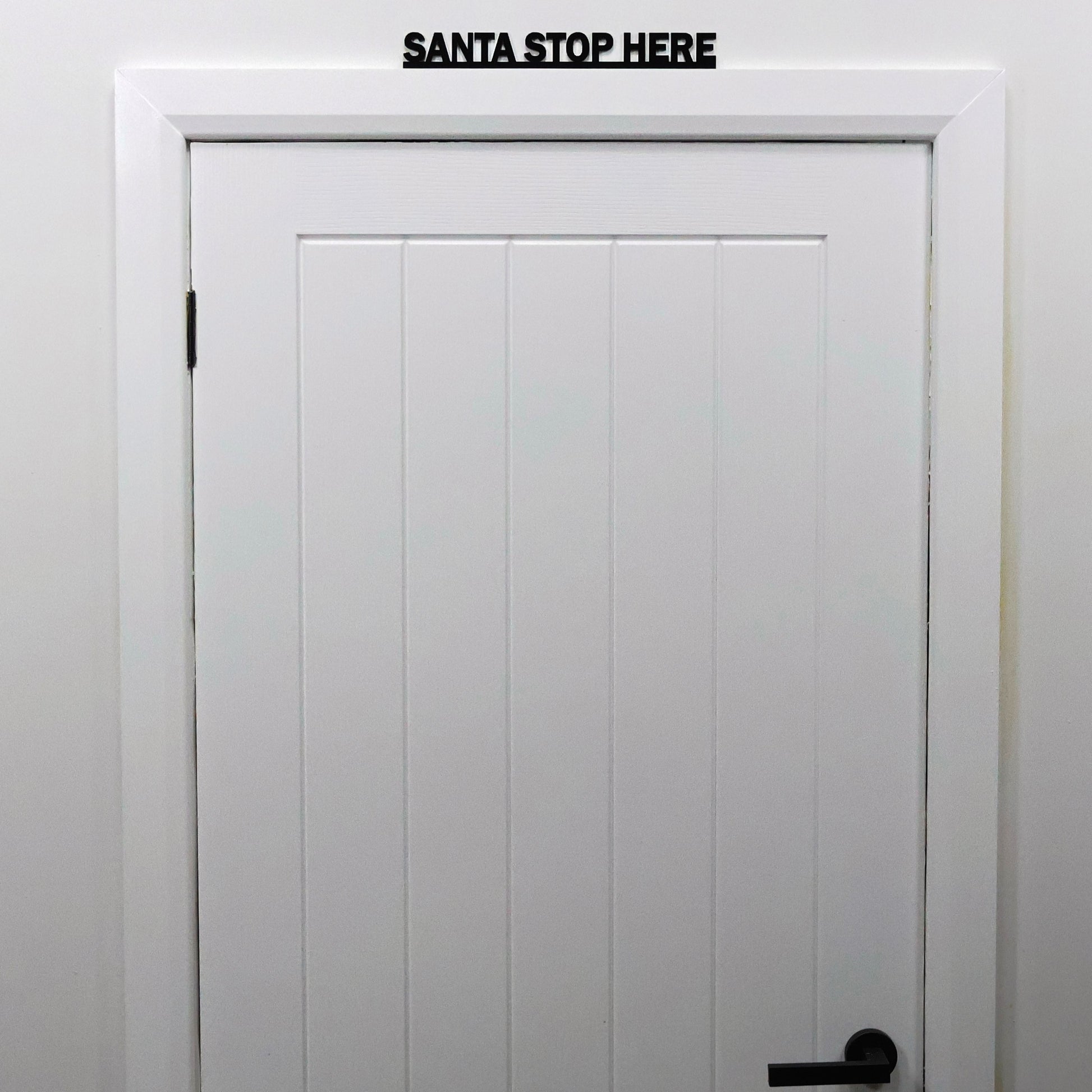 SANTA STOP HERE Door Topper - festive black acrylic wall sign handmade in the UK
