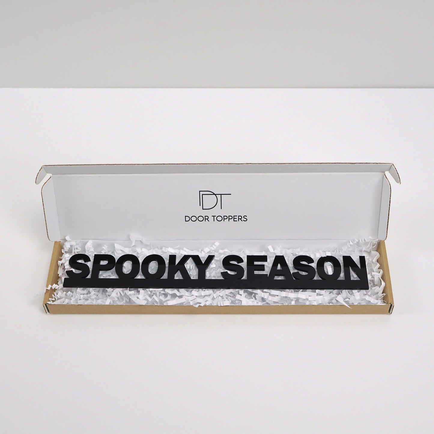 Eco friendly packaging for the SPOOKY SEASON Door Topper handmade in the UK