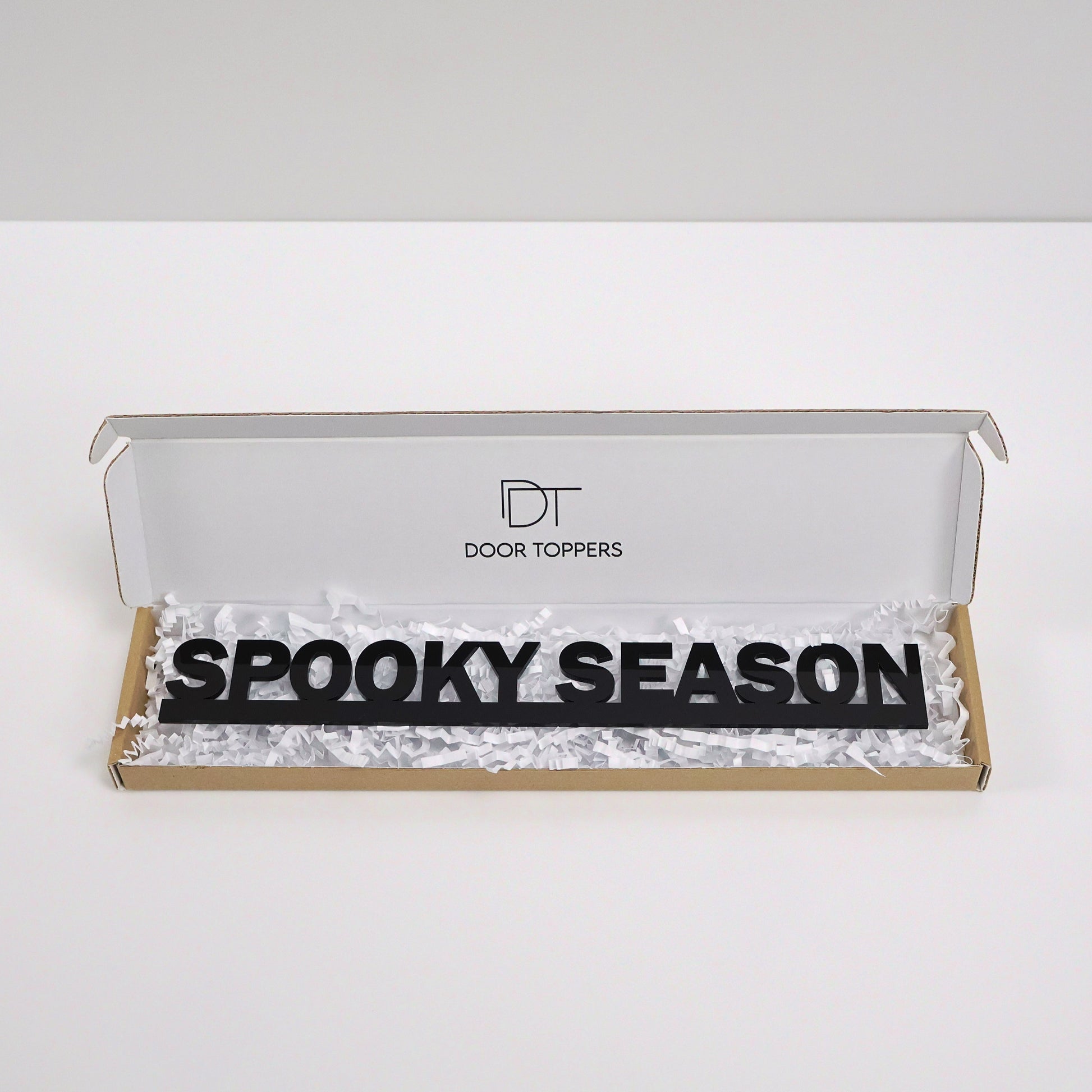 Eco friendly packaging for the SPOOKY SEASON Door Topper handmade in the UK