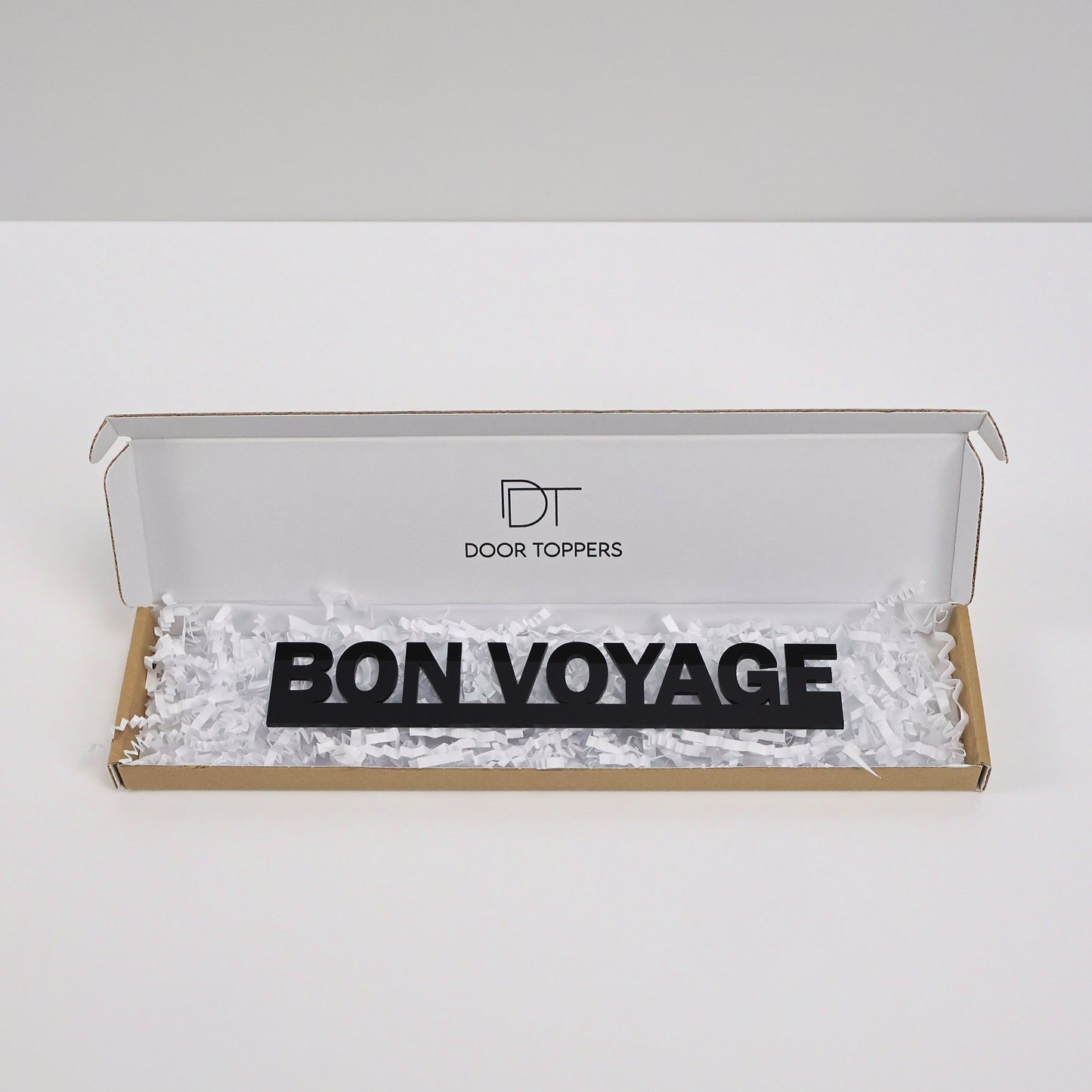 Eco-friendly packaging showing the black acrylic sign gift-ready.