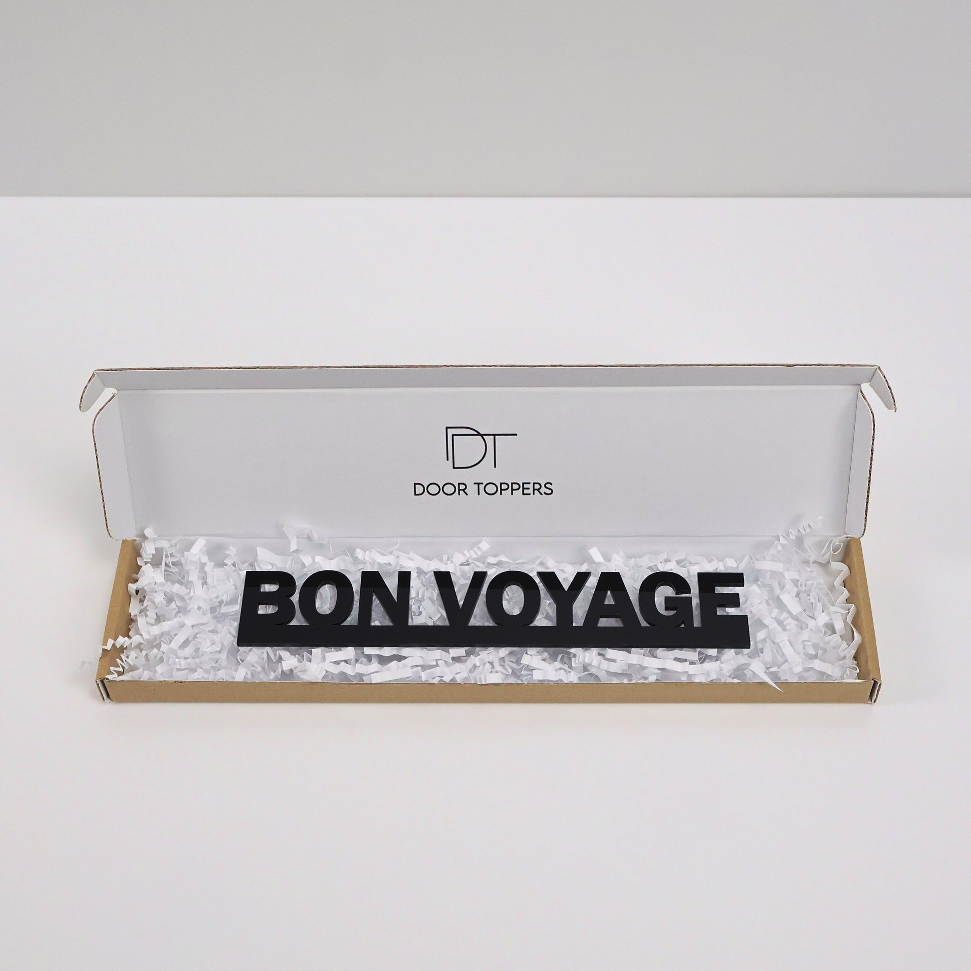 Eco-friendly packaging showing the black acrylic sign gift-ready.