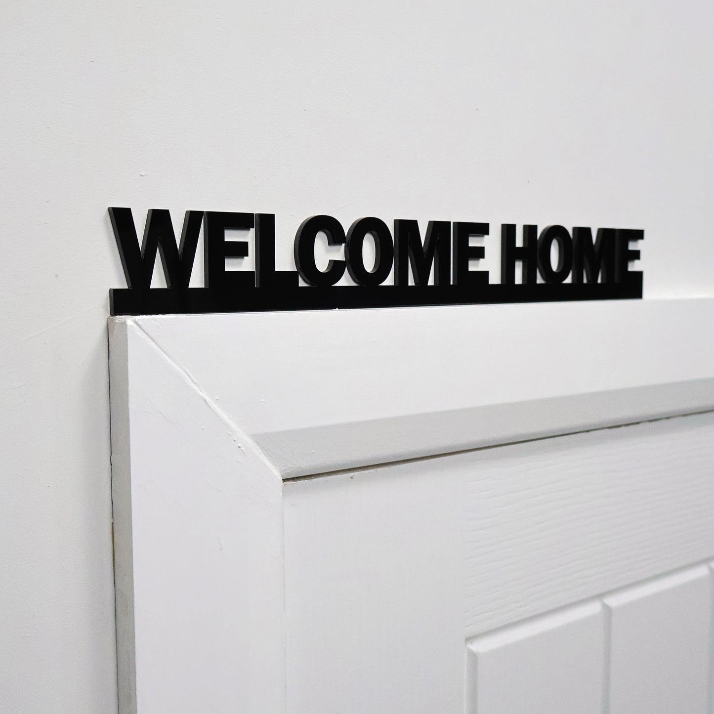 WELCOME HOME sign styled with neutral home accessories – ideal new home gift