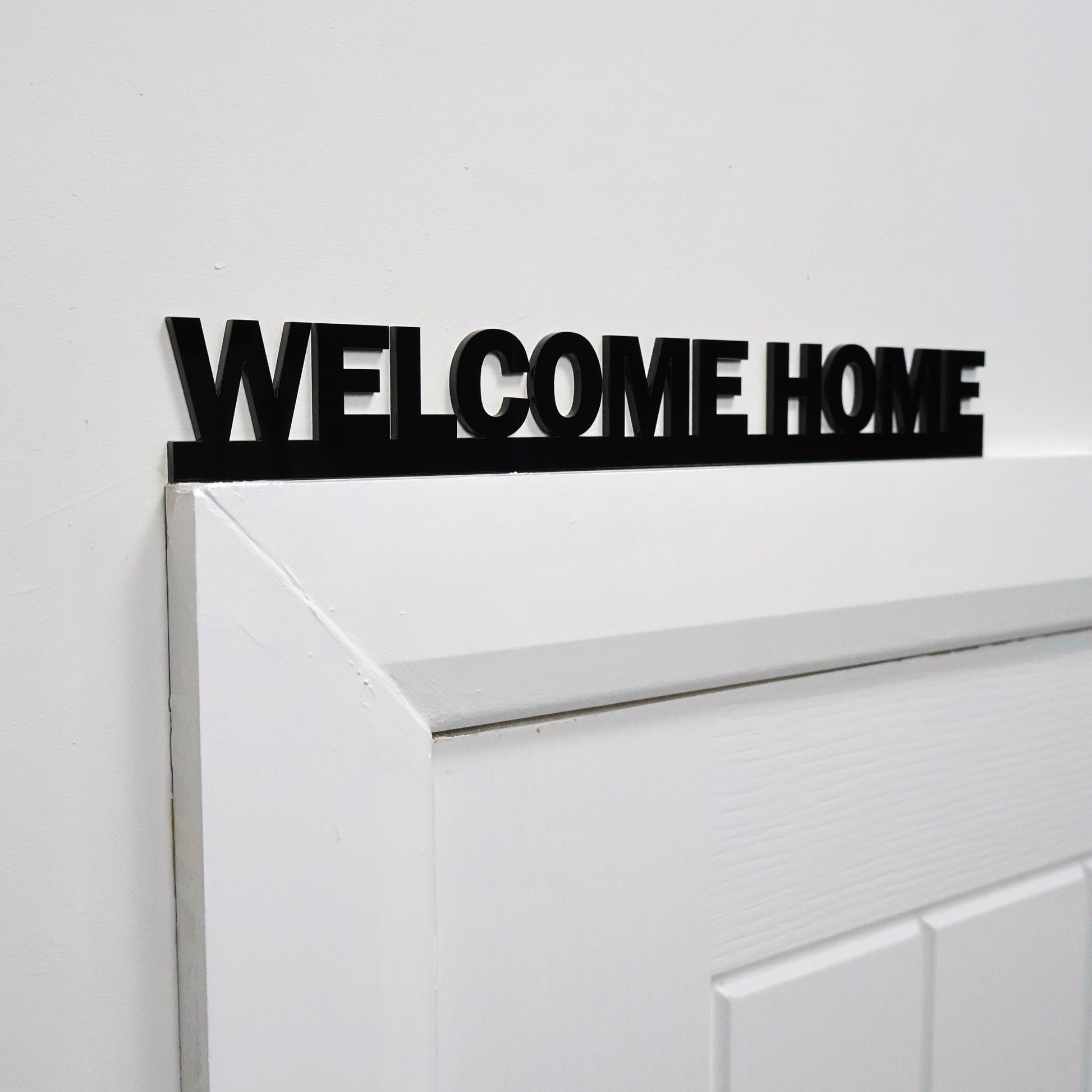WELCOME HOME sign styled with neutral home accessories – ideal new home gift