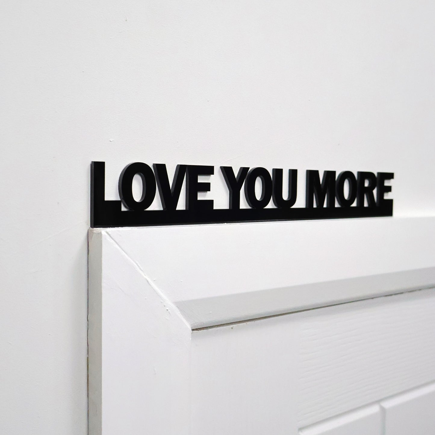 Side angle showing lightweight sign on door frame – easy to display