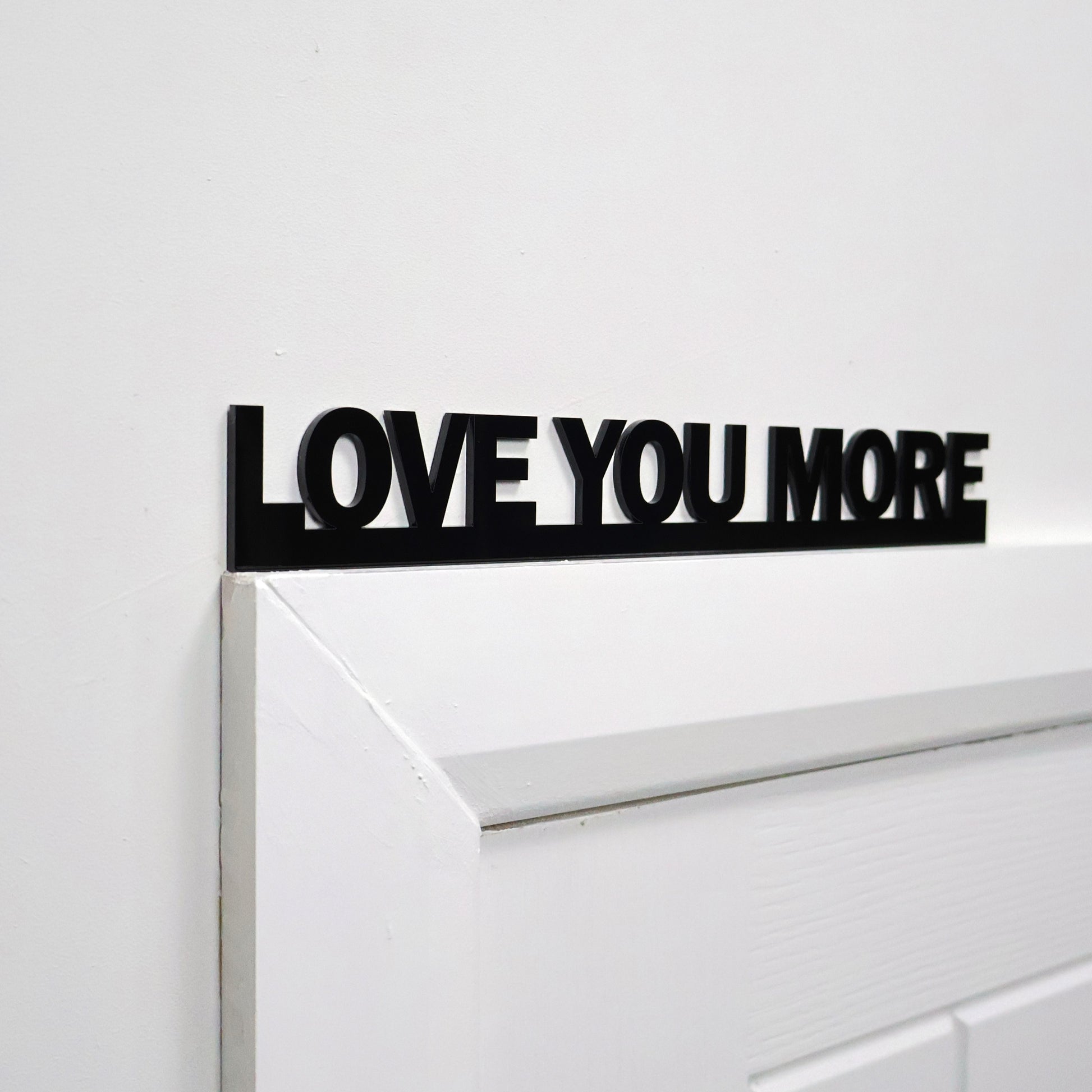 Side angle showing lightweight sign on door frame – easy to display