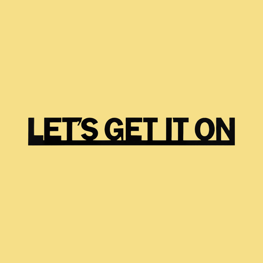 LET’S GET IT ON Door Topper Sign on a butter-yellow background