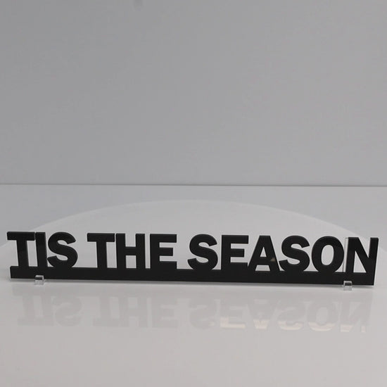 Close-up of glossy black acrylic lettering on the TIS THE SEASON Christmas Door Topper