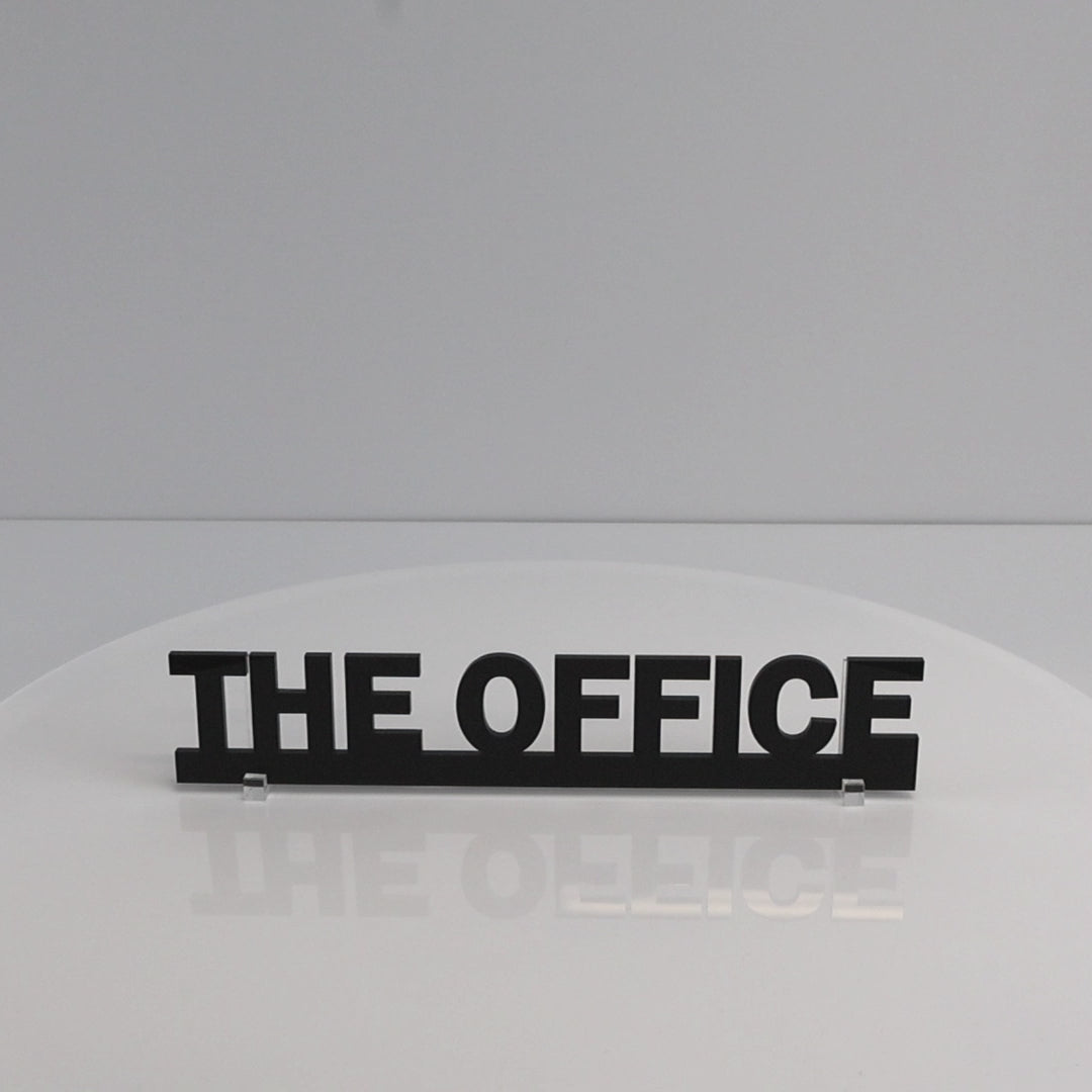Close-up of THE OFFICE lettering – smooth gloss recycled acrylic finish