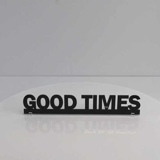 Gloss black recycled acrylic Door Topper rotating to show sleek finish