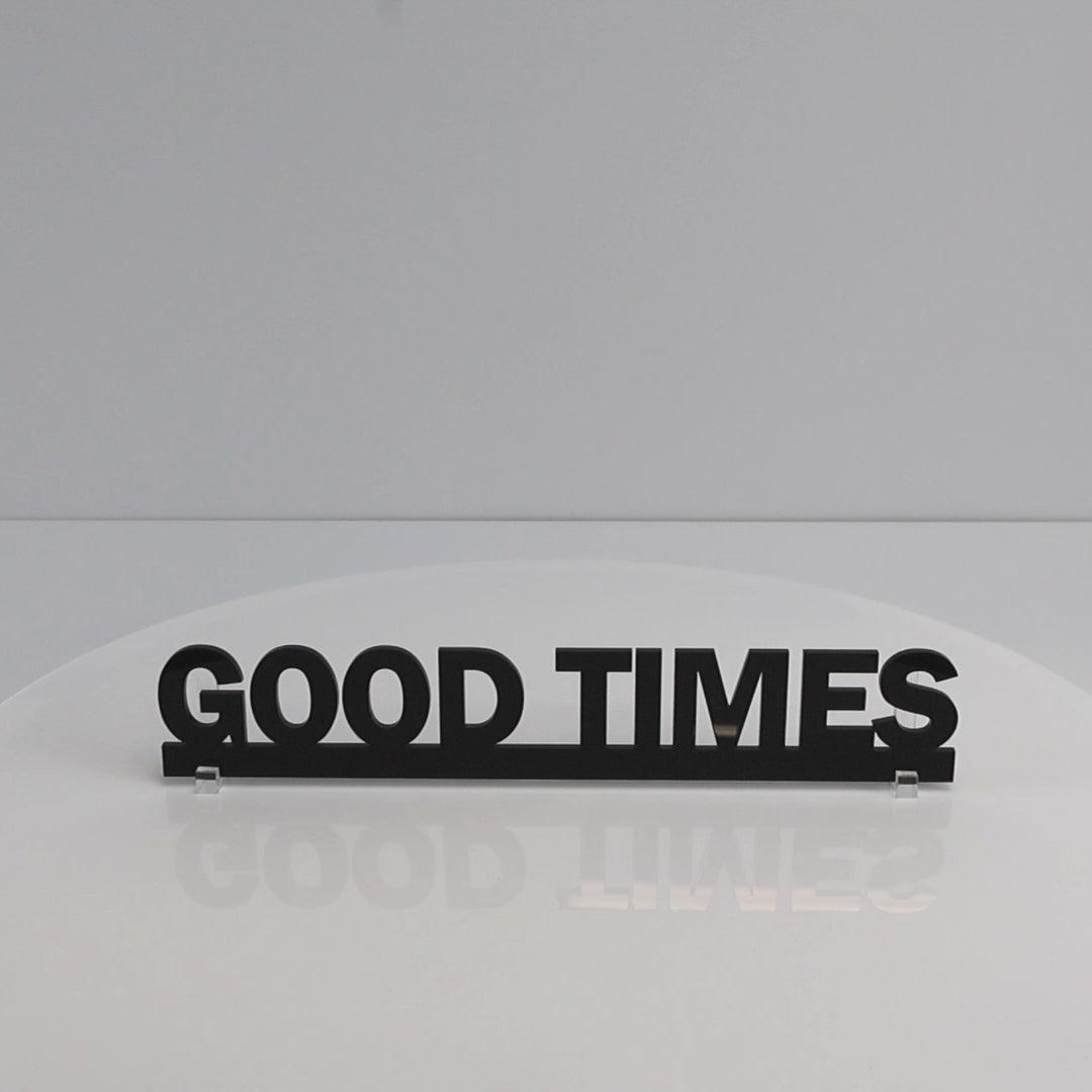 Gloss black recycled acrylic Door Topper rotating to show sleek finish