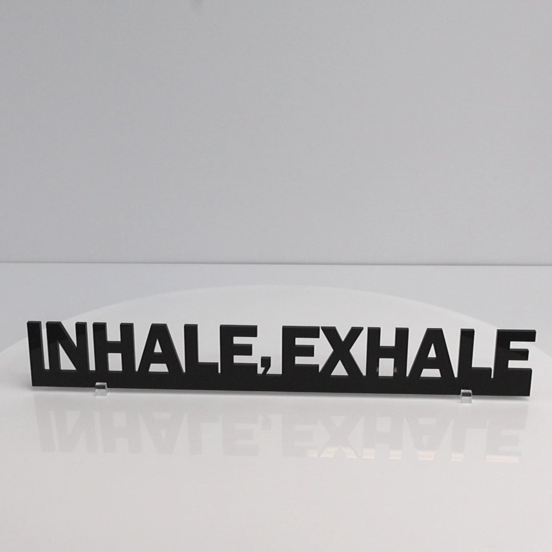 Rotating close-up video of INHALE EXHALE mindfulness quote door topper sign