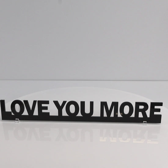 Gloss black LOVE YOU MORE Door Topper rotating to show recycled acrylic finish