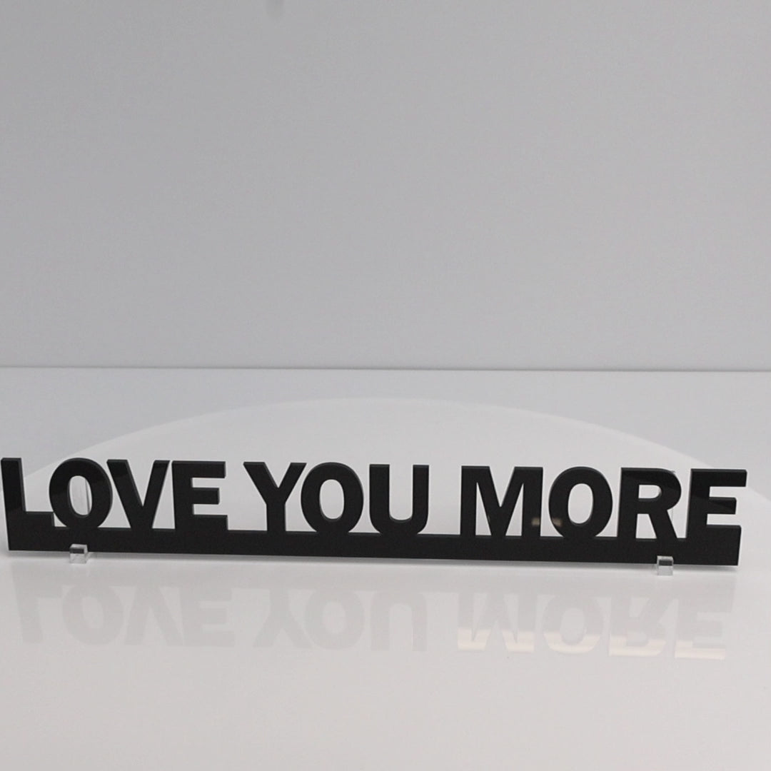Gloss black LOVE YOU MORE Door Topper rotating to show recycled acrylic finish