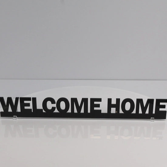 Rotating close up video of WELCOME HOME sign highlighting detail